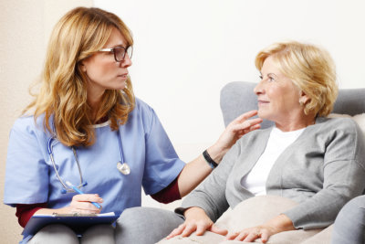 caregiver and middle aged woman talking